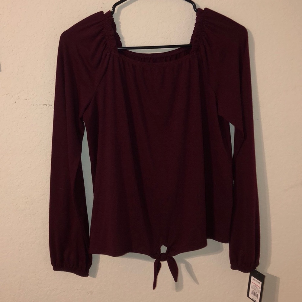 A Burgundy long sleeve shirt